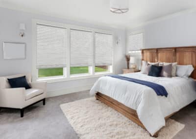 Beautiful master bedroom in new luxury home. Has large bank of windows