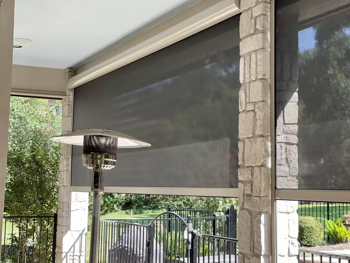 Motorized exterior shade with solar mesh fabric covering a patio opening in Venice, FL
