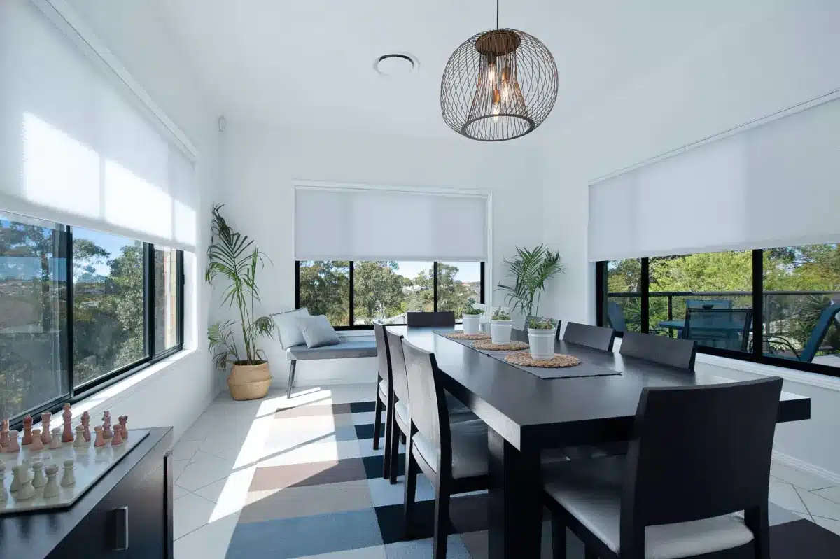 Solar shades filtering in light into a well-lit kitchen