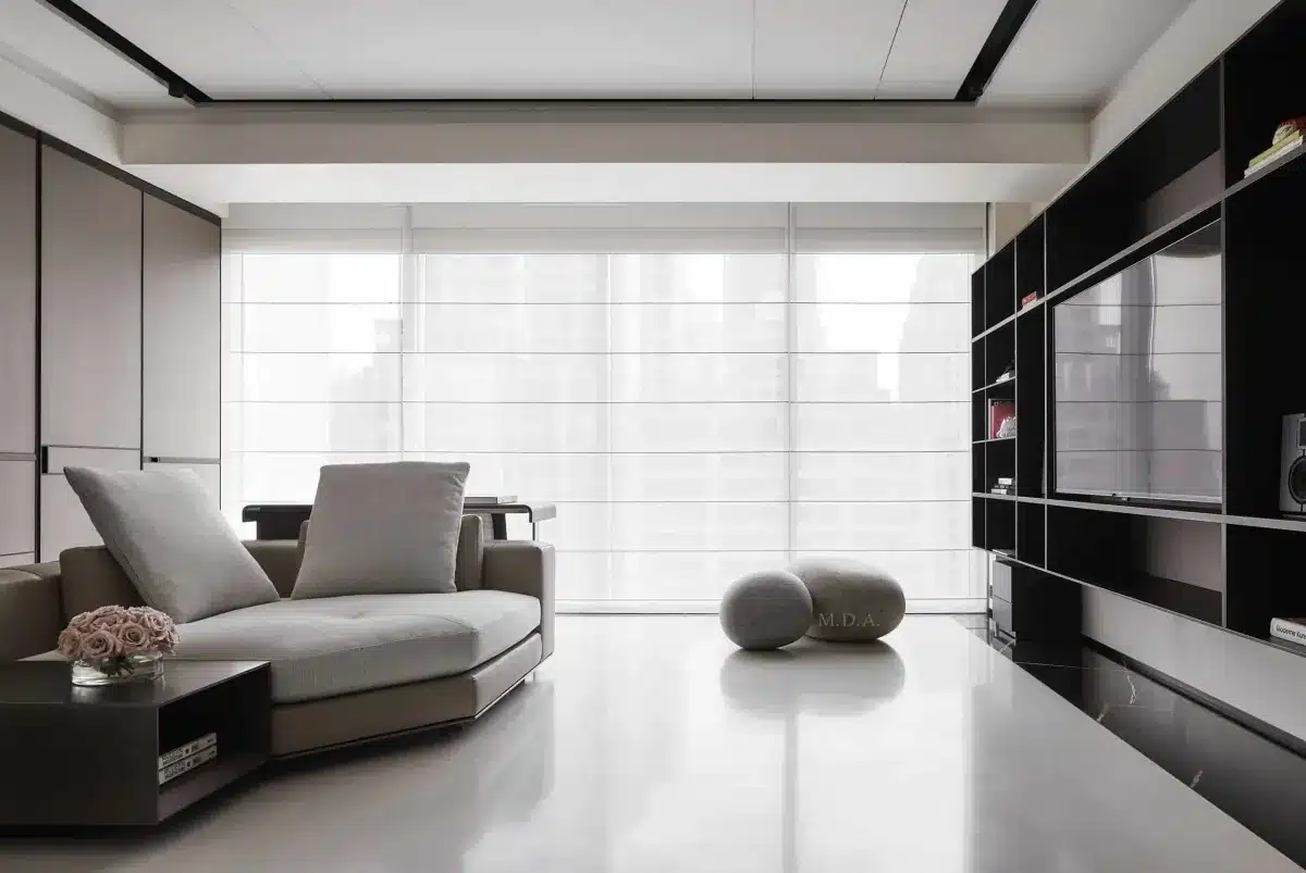 Modern living room with floor-to-ceiling Roman shades filtering natural light over the city skyline in Venice, FL