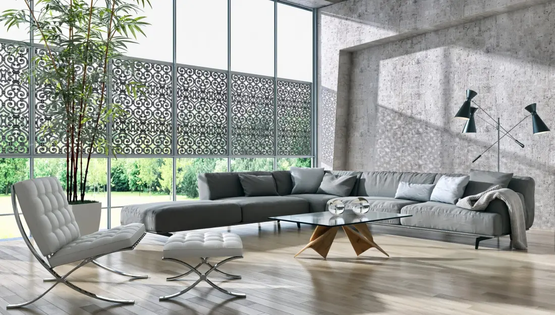 Modern living room with decorative patterned window grilles filtering natural light in Venice, FL