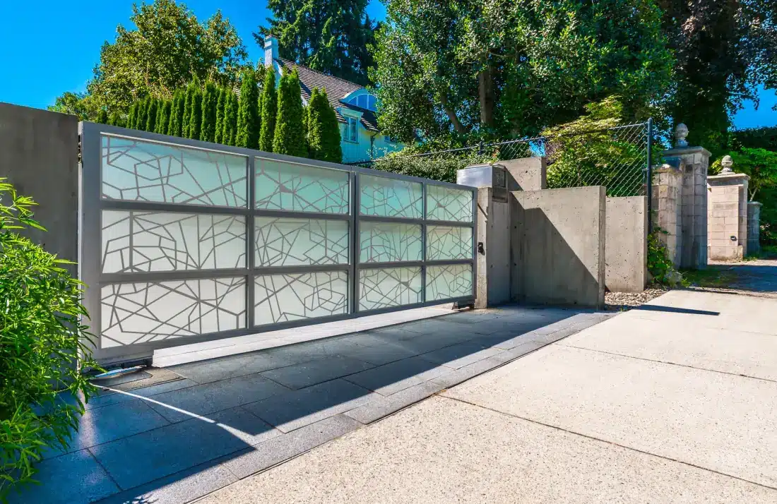 Modern garage gate with decorative metal grille pattern and frosted glass panels in Venice, FL