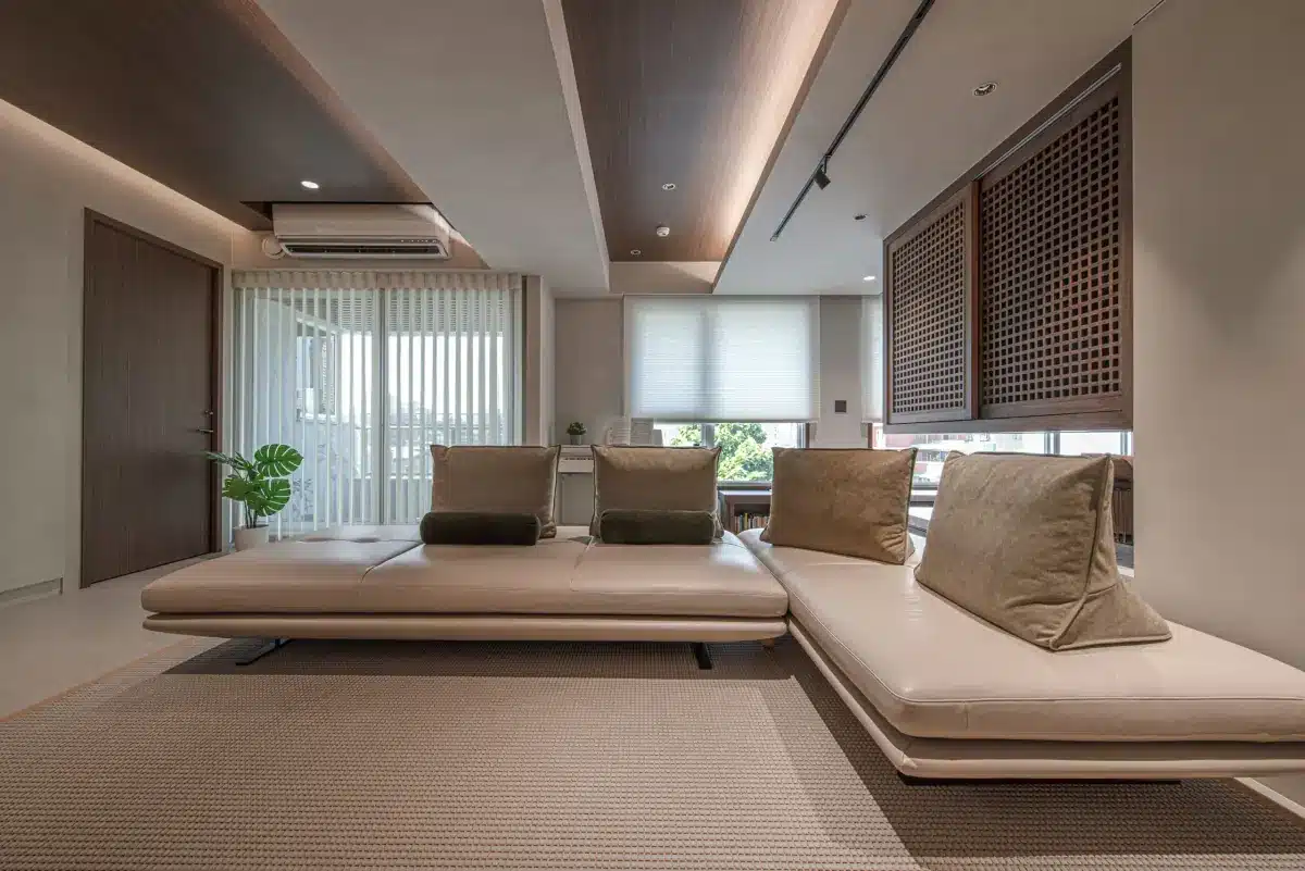 Modern living room with white roller shades on large windows and contemporary seating in Venice, FL