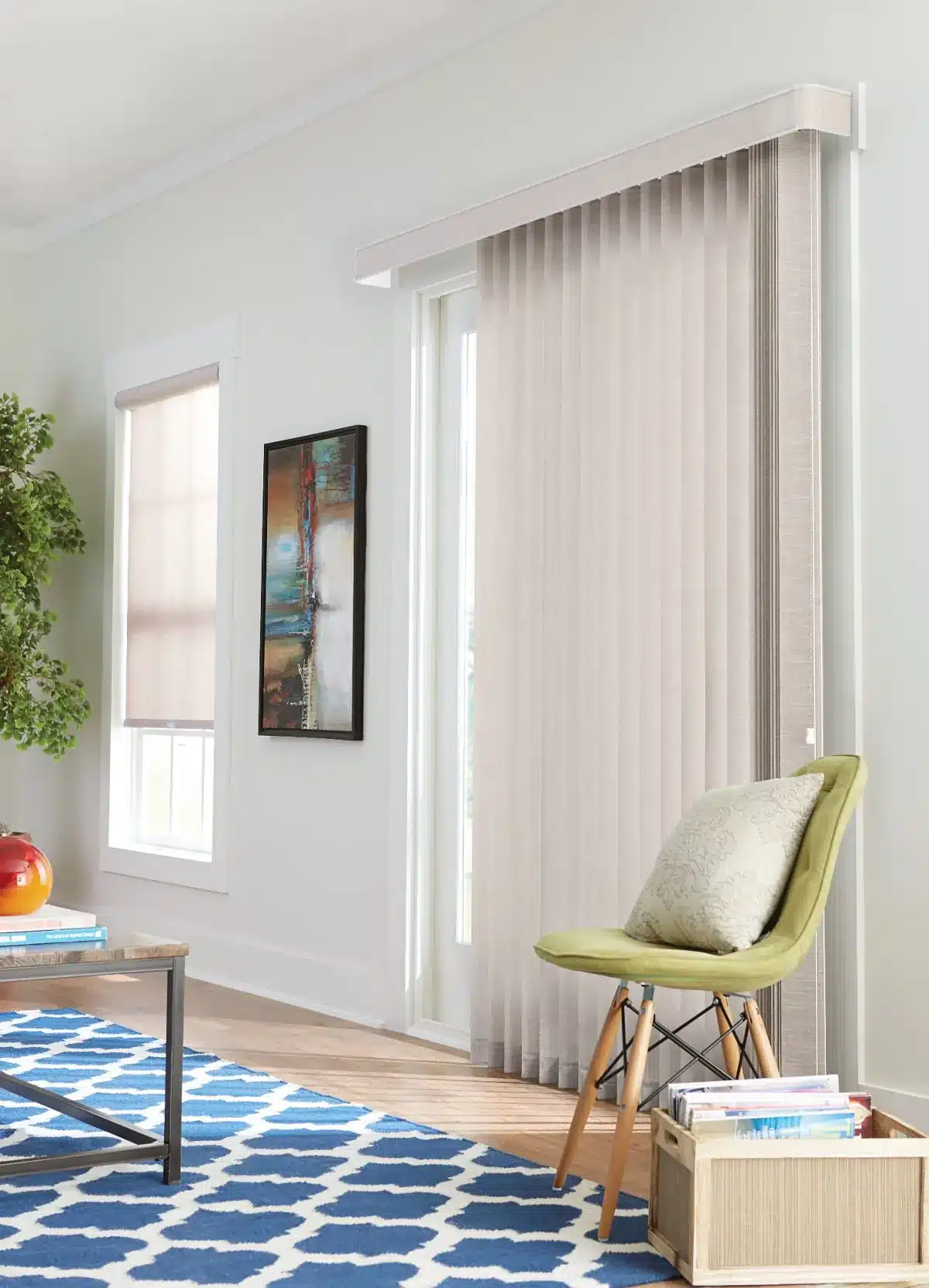Cream vertical blinds frame a glass door in a bright living room with modern furniture in Venice, FL
